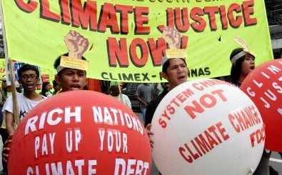 Menschen in Manila fordern Klimagerechtigkeit von den Industrienationen.