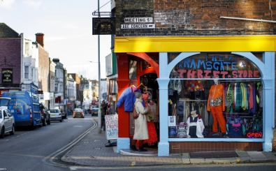 A woman enters a thrift store in Ramsgate, south east England on January 8, 2019. – In the Port of Ramsgate, dredging is under way to prepare the harbour for use in case of delays at the Port of Dover after March 29, the date the UK is set to leave the European Union. (Photo by Tolga Akmen / Tolga Akmen / AFP)