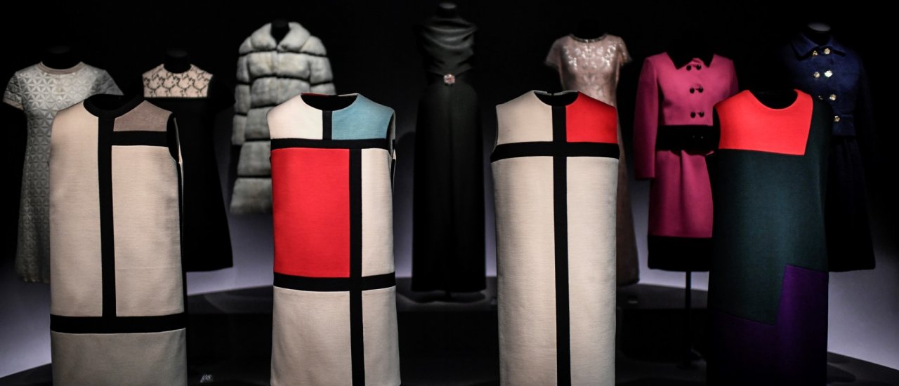 This photograph taken on February 11, 2019, shows creations of Mondrian and Lalanne models by the late French designer Yves Saint Laurent on display at The Yves Saint Laurent Museum on Avenue Marceau in Paris. – The display of creations will open to the public in the historic fashion house of the iconic French designer on February 12. (Photo by STEPHANE DE SAKUTIN / AFP)
