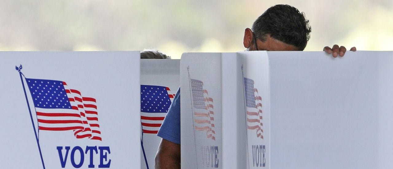 Voters cast their ballots for the midterms at a polling station in Kissimmee, Florida on November 8, 2022. (Photo by Gregg Newton / AFP)