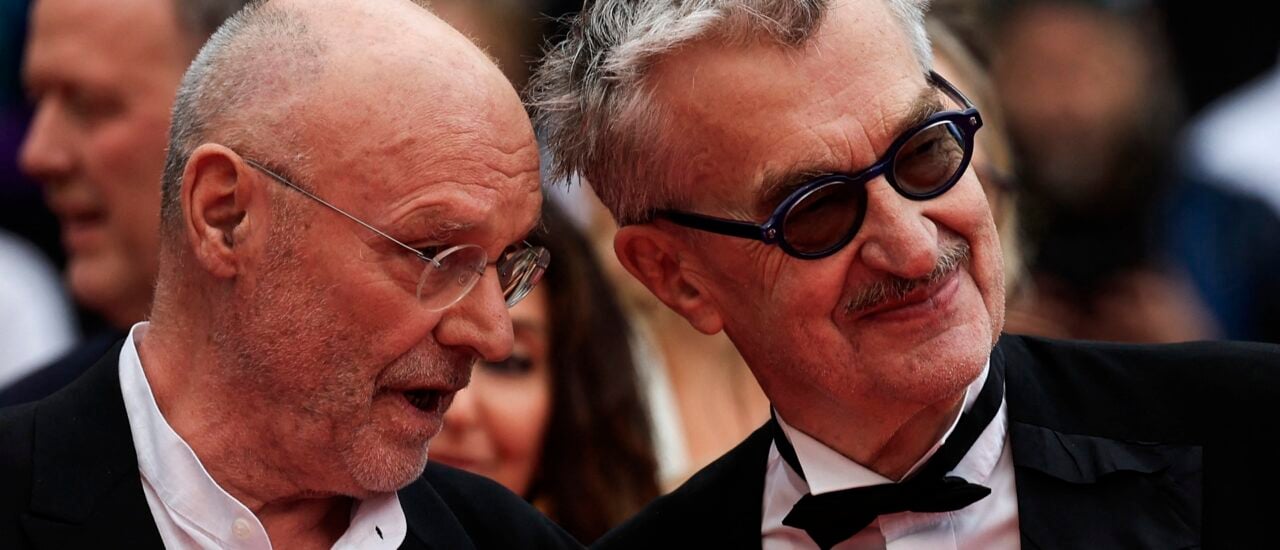 German artist Anselm Kiefer (L) and German director Wim Wenders arrive for the screening of the film „Anselm“ (Anselm – Das Rauschen der Zeit) during the 76th edition of the Cannes Film Festival in Cannes, southern France, on May 17, 2023. (Photo by Valery HACHE / AFP)