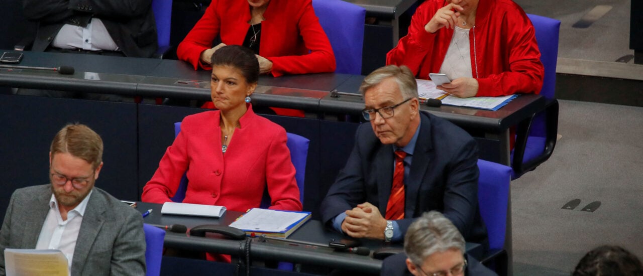 Parliamentary group leaders of Die Linke (The Left) party, Sahra Wagenknecht (center L), and Dietmar Bartsch (center R) listen during a session at the Bundestag (lower house of parliament) on March 21, 2019 in Berlin, ahead of a EU summit largely devoted to Brexit. (Photo by Odd ANDERSEN / AFP)