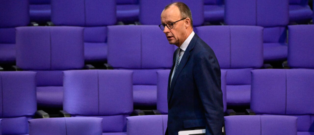 Leader of Germany’s Christian Democratic Union CDU Friedrich Merz walks past empty seats as he arrives prior to a plenary session at the Bundestag (German lower house of parliament) in Berlin, Germany, on January 30, 2024 with a final debate of the 2024 federal budget. (Photo by Tobias SCHWARZ / AFP)
