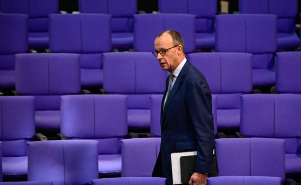 Leader of Germany’s Christian Democratic Union CDU Friedrich Merz walks past empty seats as he arrives prior to a plenary session at the Bundestag (German lower house of parliament) in Berlin, Germany, on January 30, 2024 with a final debate of the 2024 federal budget. (Photo by Tobias SCHWARZ / AFP)