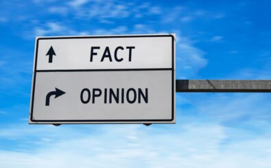 Fact versus opinion road sign.