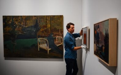 An art dealer mounts a painting by German artist Josef Albers next to an artwork by US artist Noah Davis, entitled „Delirium“ in David Zwirner Gallery stand at the Grand Palais Ephemere as part of Paris+ par Art Basel show in Paris, on October 18, 2023. (Photo by Dimitar DILKOFF / AFP) / RESTRICTED TO EDITORIAL USE – MANDATORY MENTION OF THE ARTIST UPON PUBLICATION – TO ILLUSTRATE THE EVENT AS SPECIFIED IN THE CAPTION – RESTRICTED TO EDITORIAL USE – MANDATORY MENTION OF THE ARTIST UPON PUBLICATION – TO ILLUSTRATE THE EVENT AS SPECIFIED IN THE CAPTION /