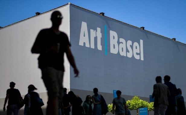 Visitors are seen at the entrance of Art Basel the world’s premier modern and contemporary art fair during the preview day on June 13, 2017 in Basel. Art Basel will take place to the public from June 15 to 18 in Basel. (Photo by Fabrice COFFRINI / AFP)